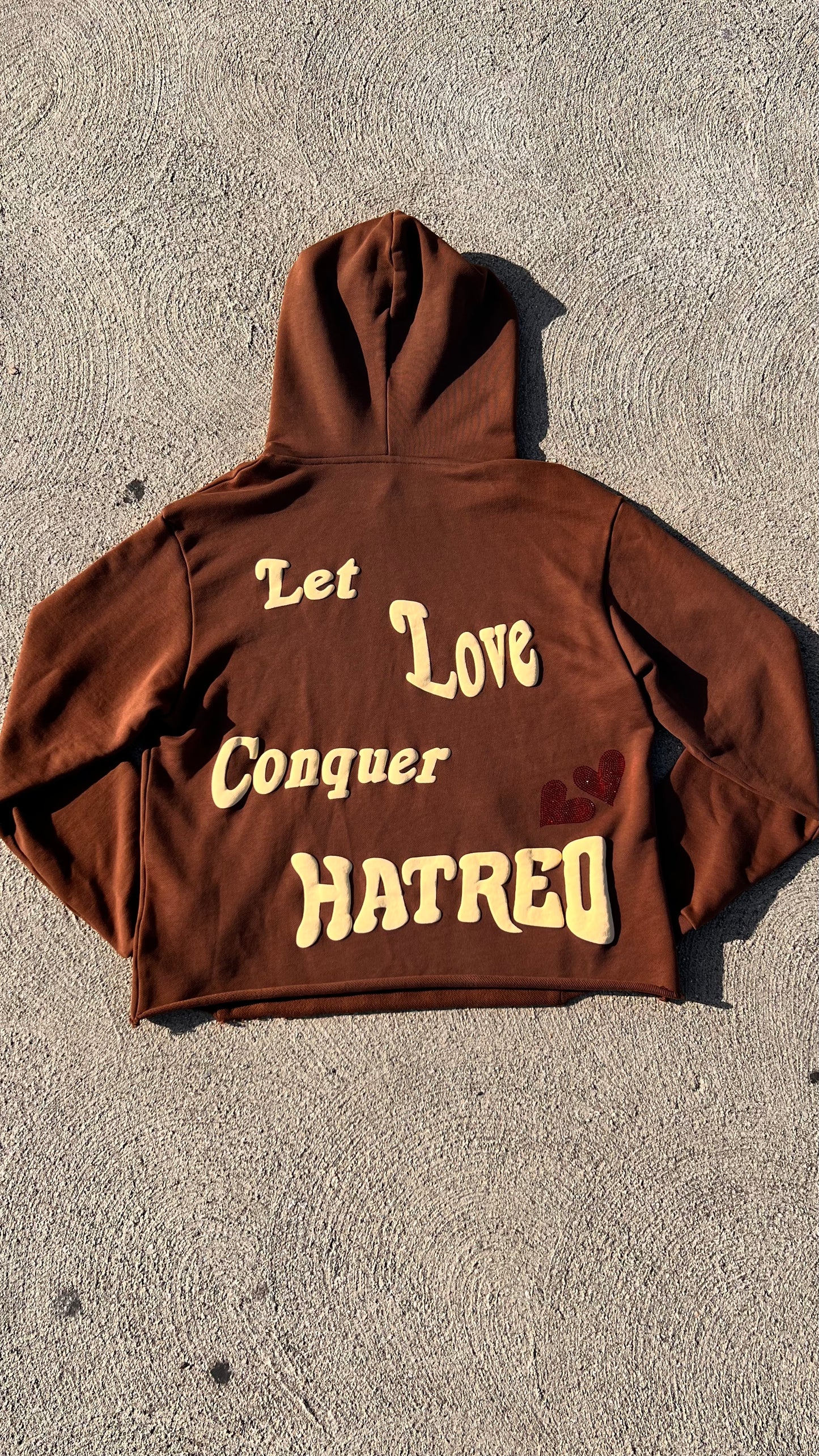 Let love conquer hatred - Brown